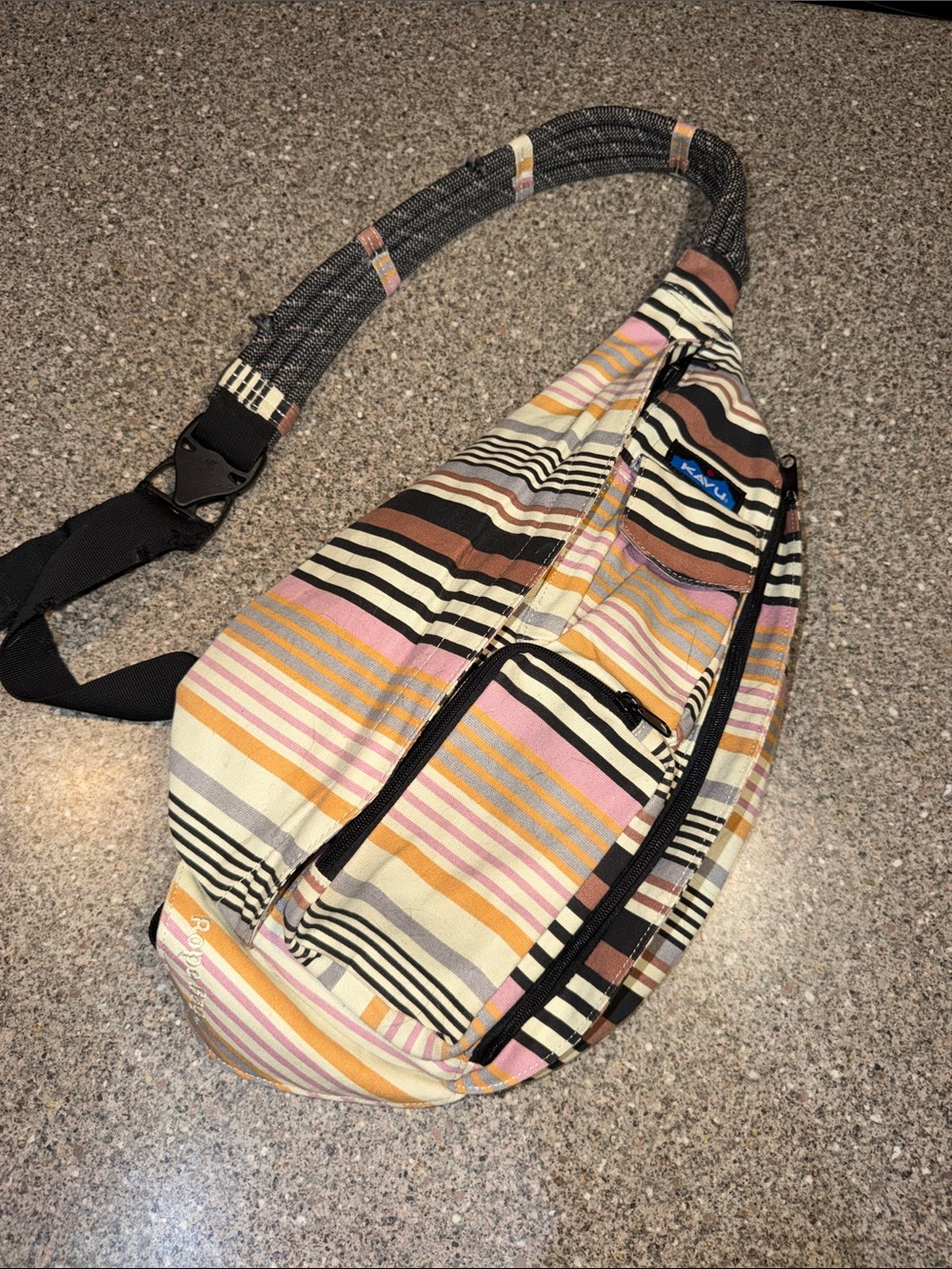 Kavu Multicolor Striped Sling Bag with Pink, Tan, Black and Cream